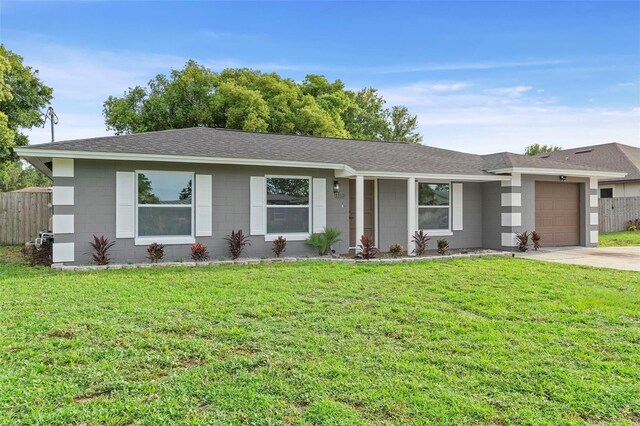 5310 Pineview Way, Apopka, FL 32703 - ranch-style house featuring a garage, roof with shingles, and driveway