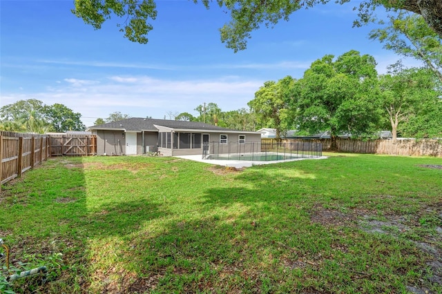 5310 Pineview Way, Apopka, FL 32703 - fenced backyard with a sunroom and a patio area
