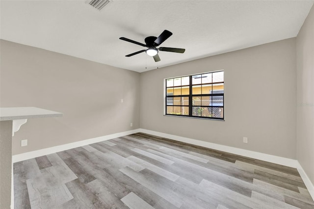 1838 Windmill Dr, Orlando, FL 32818 - spare room featuring wood finished floors and a ceiling fan