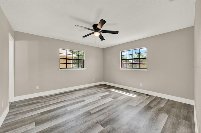 1838 Windmill Dr, Orlando, FL 32818 - spare room with plenty of natural light, wood finished floors, and ceiling fan