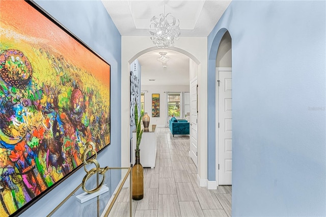 9518 Bolero Rd, Winter Garden, FL 34787 - hall with arched walkways and a chandelier