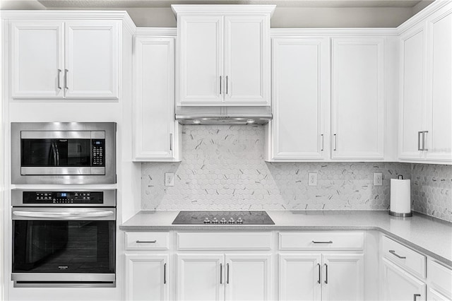 9518 Bolero Rd, Winter Garden, FL 34787 - kitchen featuring appliances with stainless steel finishes and white cabinetry