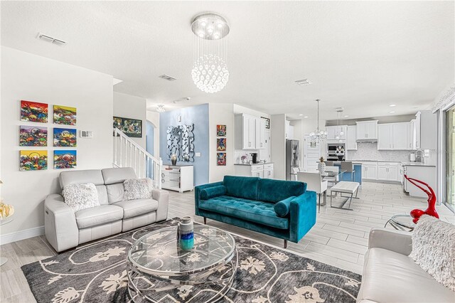 9518 Bolero Rd, Winter Garden, FL 34787 - living room with a chandelier, wood tiled floors, recessed lighting, and a textured ceiling
