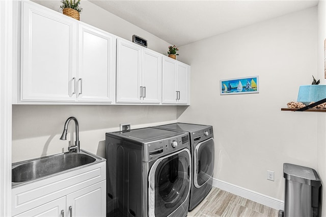 9518 Bolero Rd, Winter Garden, FL 34787 - laundry room featuring cabinet space and separate washer and dryer