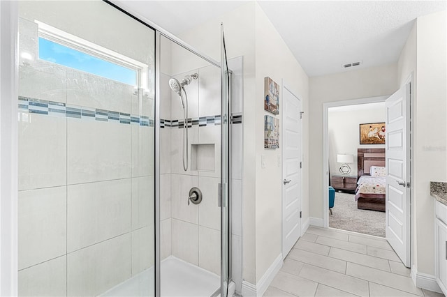 9518 Bolero Rd, Winter Garden, FL 34787 - bathroom featuring a stall shower, ensuite bath, vanity, and tile patterned floors