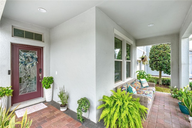 9518 Bolero Rd, Winter Garden, FL 34787 - doorway to property with stucco siding and a porch