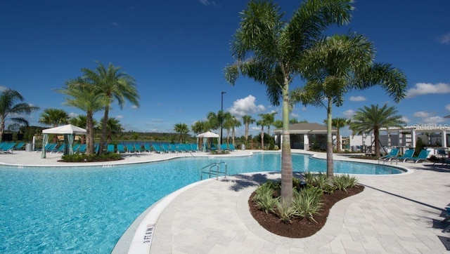 9518 Bolero Rd, Winter Garden, FL 34787 - community pool with a patio area and a gazebo