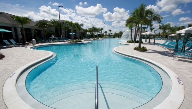9518 Bolero Rd, Winter Garden, FL 34787 - community pool with a patio