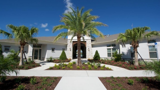 9518 Bolero Rd, Winter Garden, FL 34787 - view of front facade with french doors and stucco siding