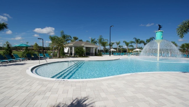 9518 Bolero Rd, Winter Garden, FL 34787 - community pool featuring a patio