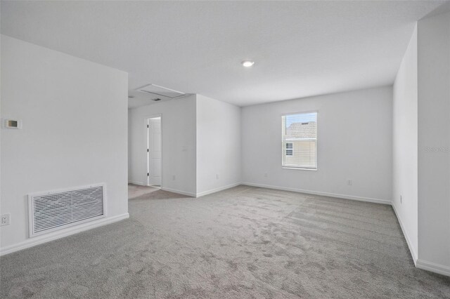 1198 Happy Forest Loop, Deland, FL 32720 - empty room with carpet floors and attic access