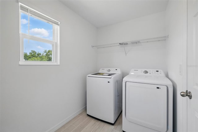 1198 Happy Forest Loop, Deland, FL 32720 - laundry area with separate washer and dryer and wood tiled floors