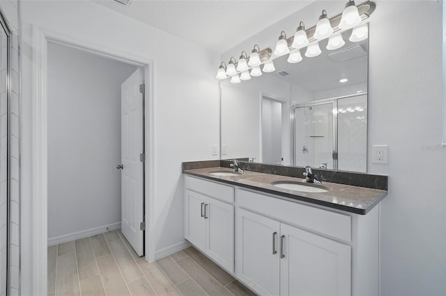 1198 Happy Forest Loop, Deland, FL 32720 - bathroom with a shower stall, double vanity, and wood finish floors