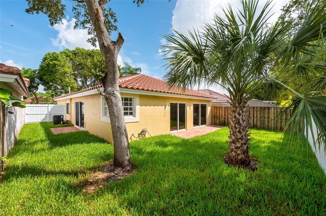 13412 NW 5th Ct, Plantation, FL 33325 - rear view of house with stucco siding, a tiled roof, and a fenced backyard
