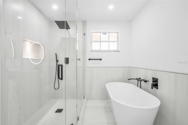 13412 NW 5th Ct, Plantation, FL 33325 - full bathroom featuring a stall shower, a freestanding tub, wainscoting, and recessed lighting