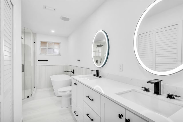 13412 NW 5th Ct, Plantation, FL 33325 - bathroom with double vanity, a closet, a freestanding bath, a shower stall, and a wainscoted wall