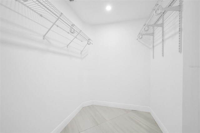 13412 NW 5th Ct, Plantation, FL 33325 - spacious closet featuring light tile patterned floors