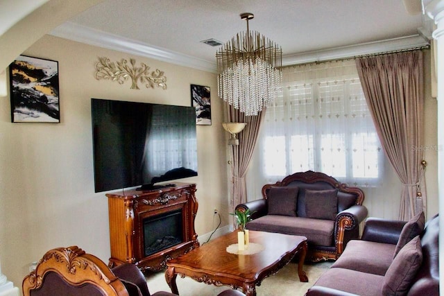2851 Swoop Cir, Kissimmee, FL 34741 - living room with a chandelier, ornamental molding, and a fireplace