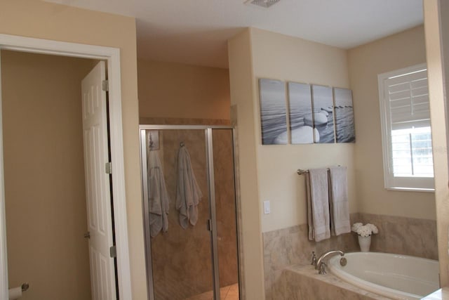 2851 Swoop Cir, Kissimmee, FL 34741 - full bathroom featuring a bath and a stall shower