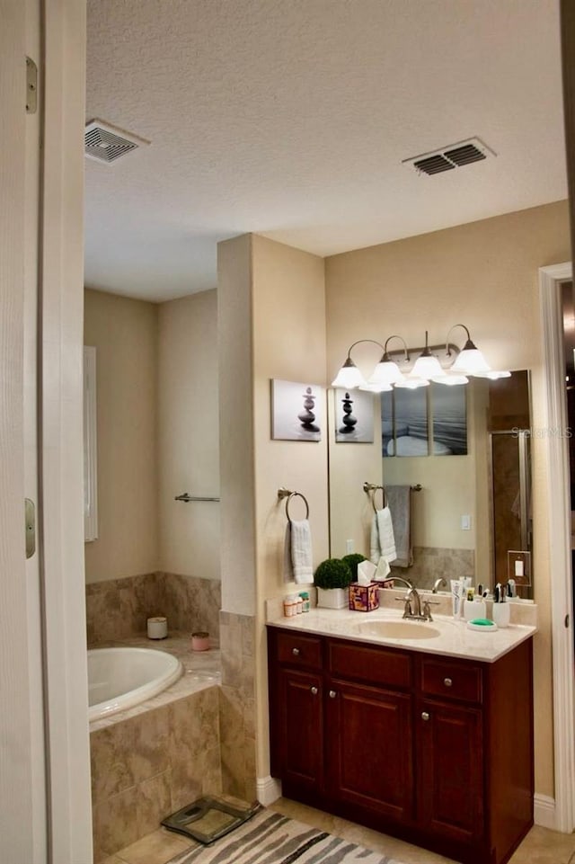 2851 Swoop Cir, Kissimmee, FL 34741 - full bath with a garden tub, vanity, a stall shower, and tile patterned flooring