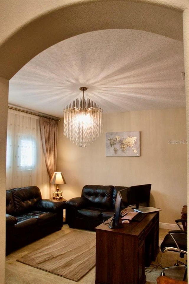 2851 Swoop Cir, Kissimmee, FL 34741 - living room featuring carpet floors and a chandelier