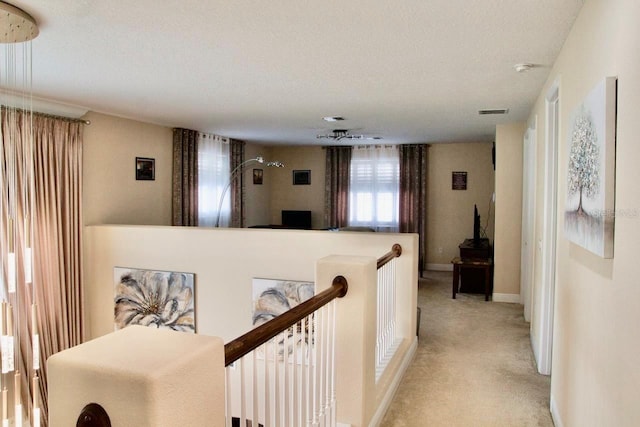 2851 Swoop Cir, Kissimmee, FL 34741 - corridor featuring light colored carpet and baseboards