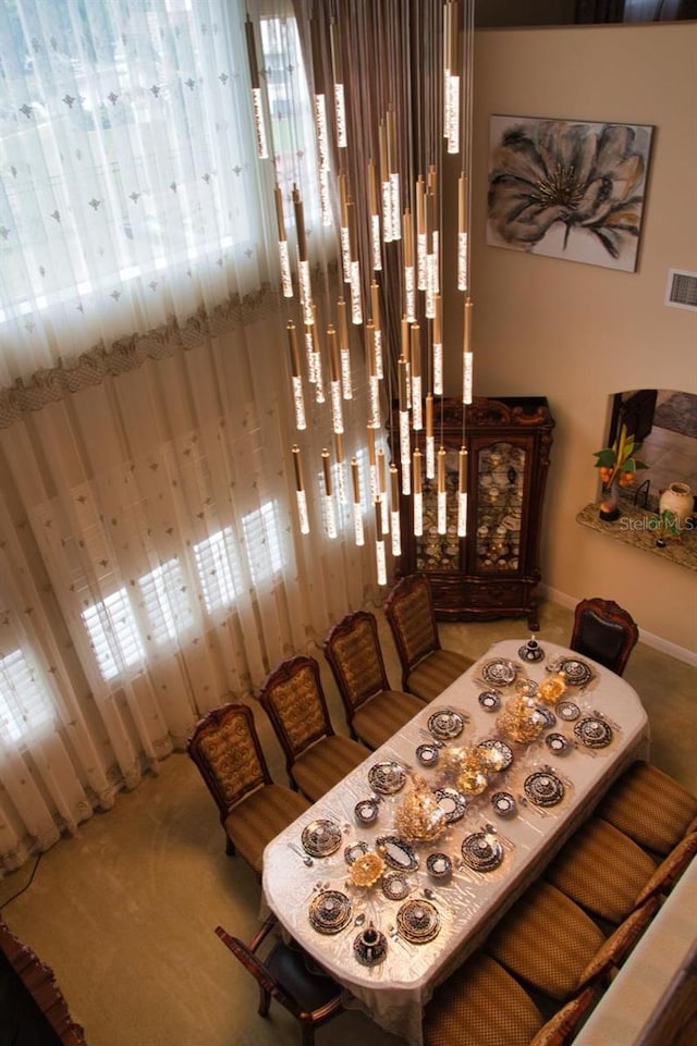 2851 Swoop Cir, Kissimmee, FL 34741 - dining area with carpet flooring and plenty of natural light