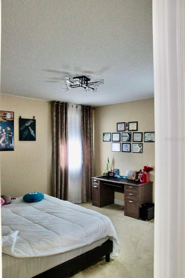 2851 Swoop Cir, Kissimmee, FL 34741 - bedroom featuring carpet and a textured ceiling