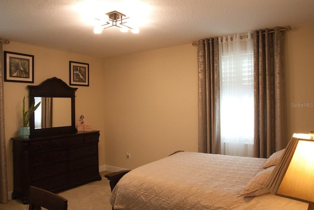 2851 Swoop Cir, Kissimmee, FL 34741 - bedroom with light carpet and baseboards