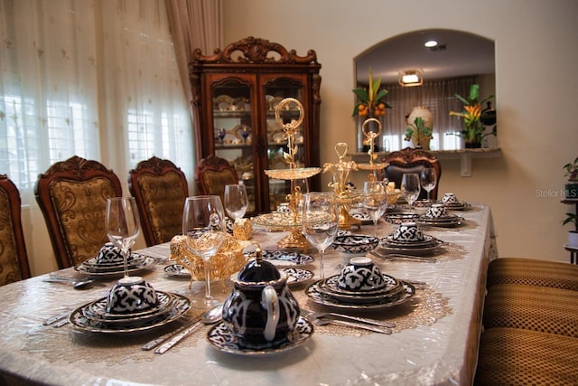 2851 Swoop Cir, Kissimmee, FL 34741 - dining area with arched walkways