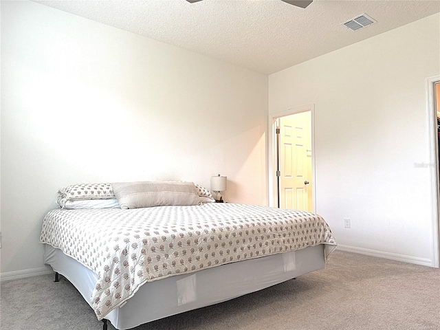 764 Richmond Estate Ave, Haines City, FL 33844 - carpeted bedroom featuring baseboards and a textured ceiling