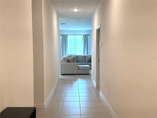 764 Richmond Estate Ave, Haines City, FL 33844 - hall with baseboards and light tile patterned floors