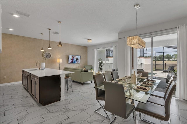 9005 Stinger Dr, Davenport, FL 33896 - dining room featuring light marble finish floors