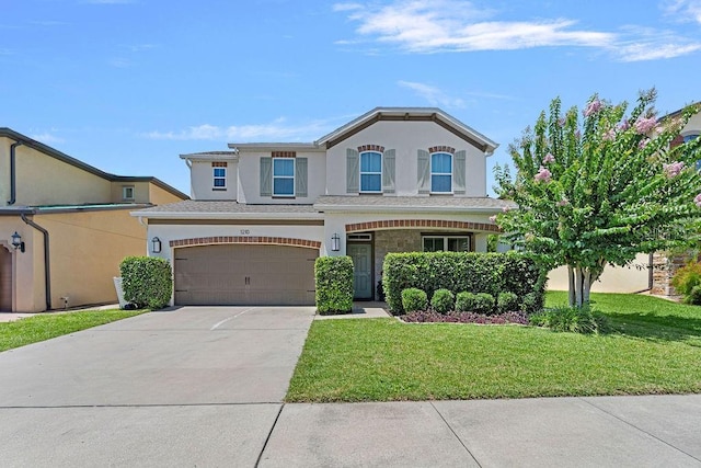 1210 Woods Landing Dr, Minneola, FL 34715 - view of front of home with driveway, a front lawn, stucco siding, and an attached garage