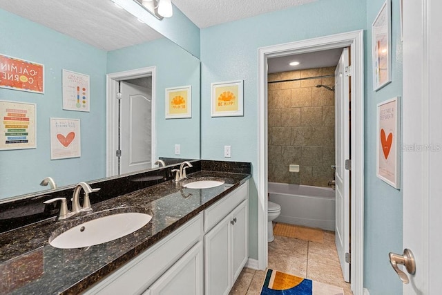 1210 Woods Landing Dr, Minneola, FL 34715 - bathroom featuring double vanity, bathtub / shower combination, tile patterned floors, and a textured ceiling