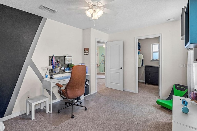 1210 Woods Landing Dr, Minneola, FL 34715 - home office featuring a textured ceiling and a ceiling fan