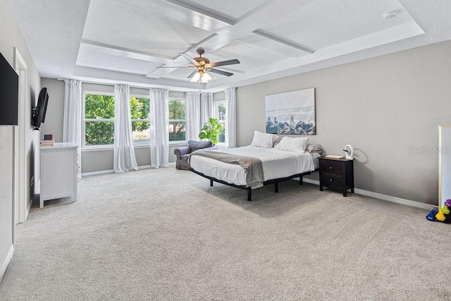 1210 Woods Landing Dr, Minneola, FL 34715 - carpeted bedroom with coffered ceiling, a ceiling fan, a textured ceiling, and beamed ceiling