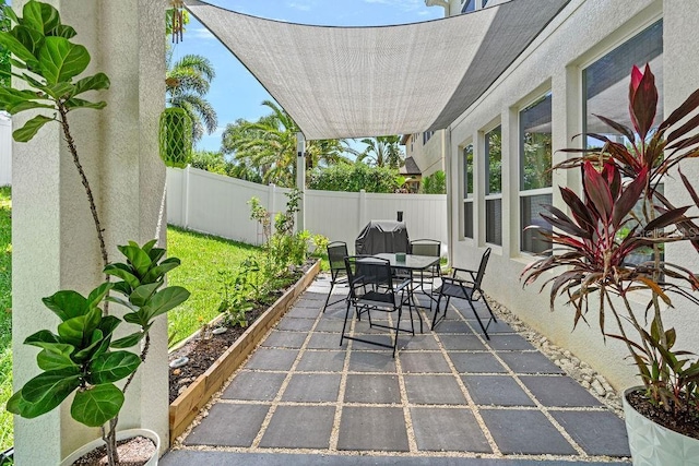 1210 Woods Landing Dr, Minneola, FL 34715 - fenced backyard featuring outdoor dining area and a patio area