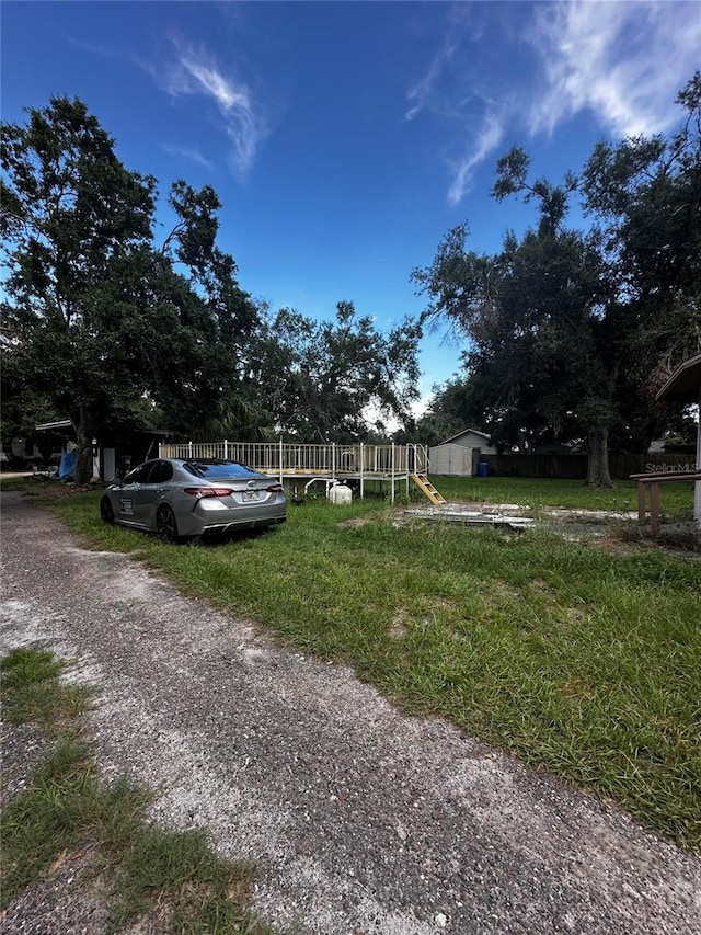 10004 Vaughn St, Gibsonton, FL 33534 - obstructed view of property with driveway
