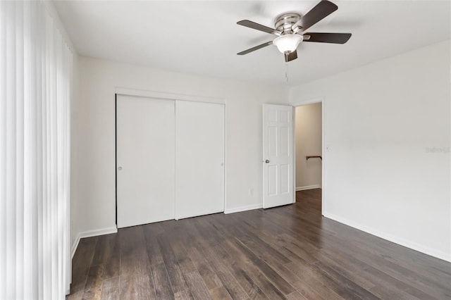 2200 S Palmetto Ave Unit B050, South Daytona, FL 32119 - unfurnished bedroom featuring dark wood-type flooring, a closet, and a ceiling fan