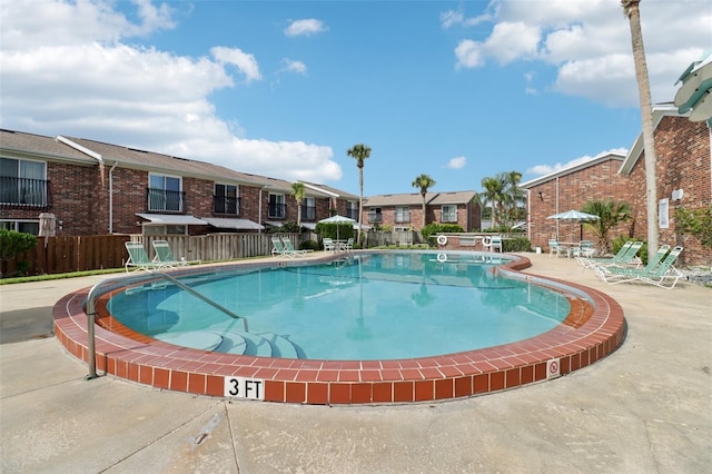 2200 S Palmetto Ave Unit B050, South Daytona, FL 32119 - community pool featuring a residential view and a patio