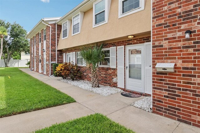 2200 S Palmetto Ave Unit B050, South Daytona, FL 32119 - view of exterior entry with brick siding and stucco siding