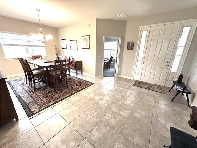 416 Riders Loop, Auburndale, FL 33823 - dining room with a chandelier and tile patterned flooring