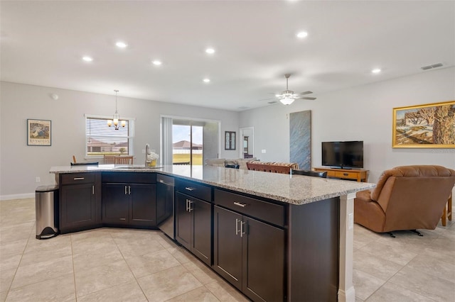 416 Riders Loop, Auburndale, FL 33823 - kitchen with open floor plan, recessed lighting, a chandelier, light stone counters, and a ceiling fan
