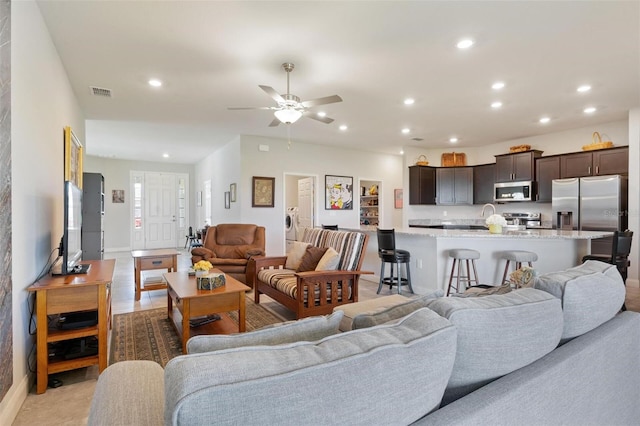 416 Riders Loop, Auburndale, FL 33823 - living area featuring recessed lighting, ceiling fan, and washer and clothes dryer