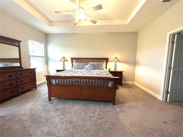 416 Riders Loop, Auburndale, FL 33823 - carpeted bedroom featuring a raised ceiling and a ceiling fan