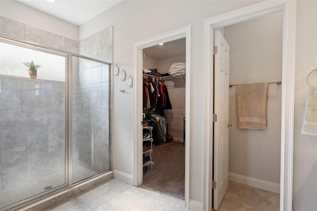416 Riders Loop, Auburndale, FL 33823 - full bath featuring a spacious closet, a shower stall, and tile patterned floors