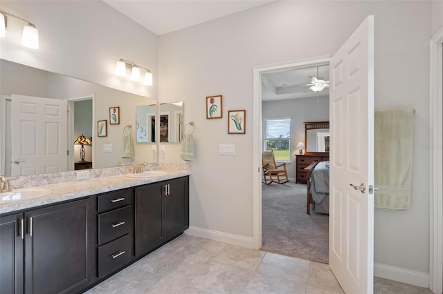 416 Riders Loop, Auburndale, FL 33823 - ensuite bathroom featuring double vanity, a ceiling fan, and tile patterned floors