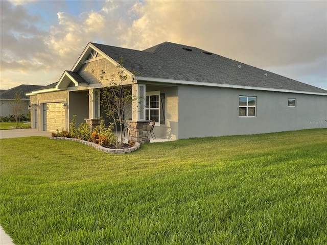 416 Riders Loop, Auburndale, FL 33823 - view of property exterior with an attached garage, a yard, stucco siding, and driveway