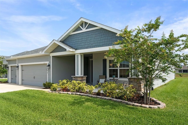 416 Riders Loop, Auburndale, FL 33823 - view of front of home featuring a front yard, a garage, driveway, a porch, and stucco siding